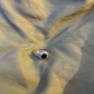 Elegant Silver Ring with Deep Blue Gem